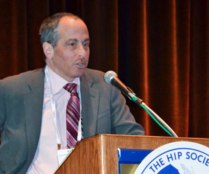 Donald Garbuz receives the 2013 John Charnley Award from The Hip Society.